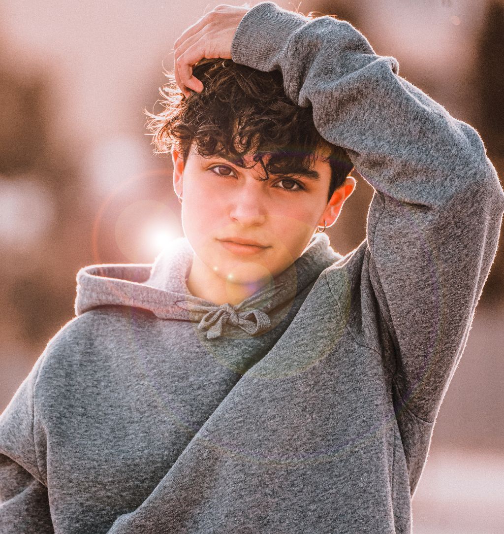 adolescent fixing his hair